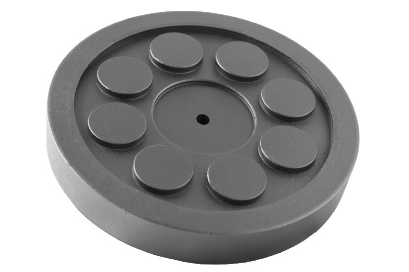 Front view of a black, round rubber pad (item no. 335160-GS5.0) for vehicle lifts, with central hole, rubber lip for slipping over, and bolting to the lift arm.