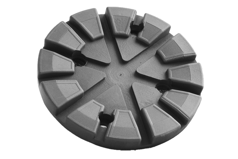 Front view of a black, round rubber pad (item no. 664000) for vehicle lifts, with four holes for bolting to the lift arm.