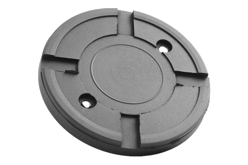 Front view of a black, round rubber pad (item no. GK122/12) for vehicle lifts, with steel plate and two holes for bolting to the lift arm.