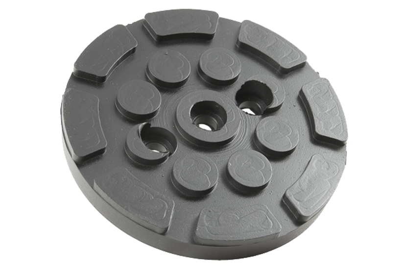 Front view of a black, round rubber pad (item no. HPOW001) for vehicle lifts, with three holes for bolting to the lift arm.