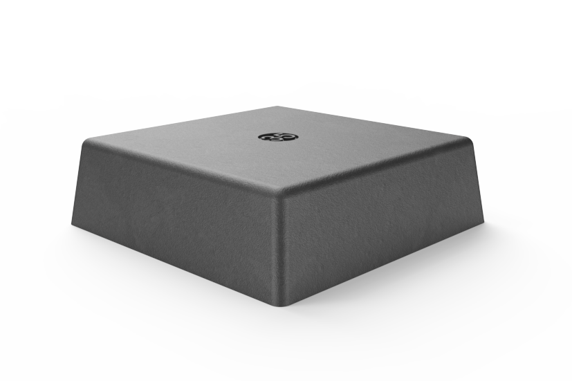 Front view of the black, square rubber block for lifting vehicles on scissor lifts. With embedded magnet for attachment to metal surfaces when not in use.