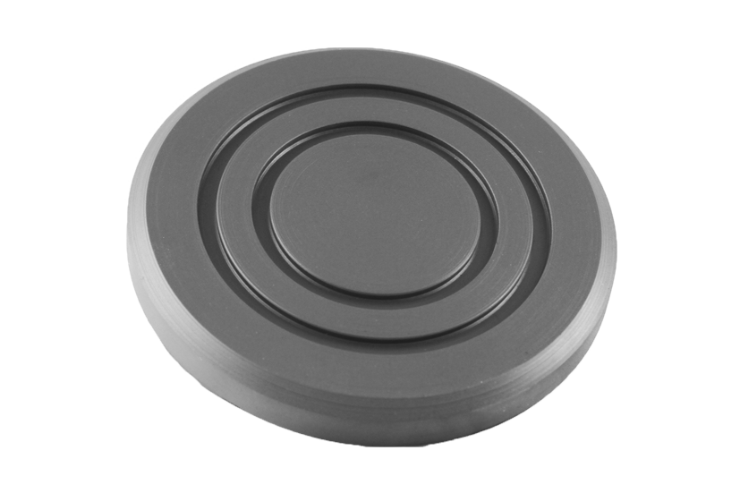 Front view of item SUM001, a round black rubber pad with a rubber lip for slip-on mounting over the lifting plate.